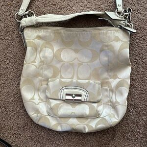 Coach satchel in creamy nude w/pink satin interior